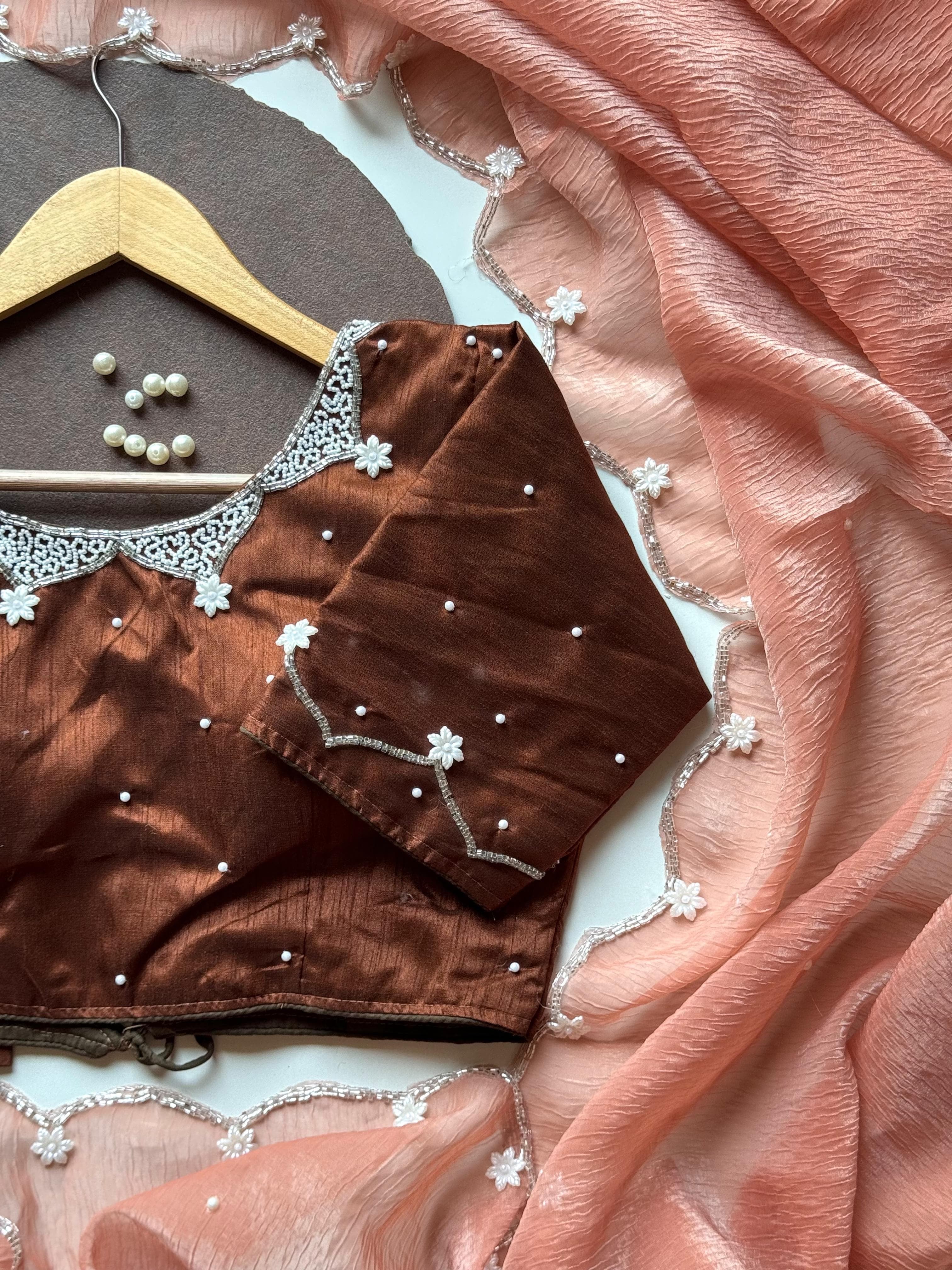 Pearls on Rust Saree